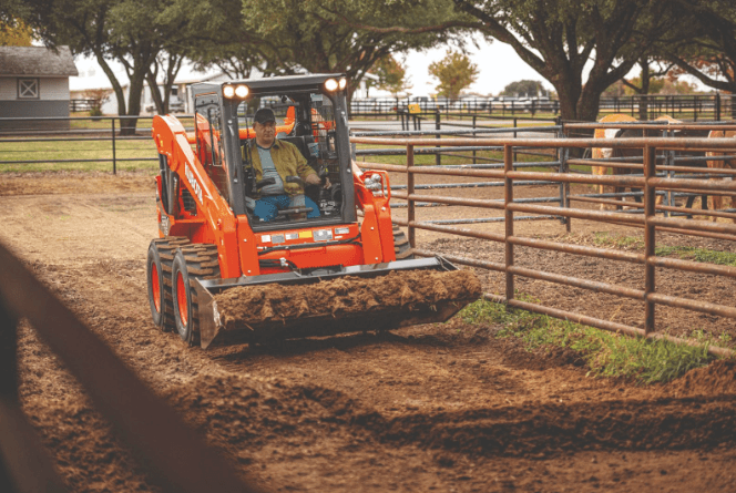 Man moving dirt onto pile
