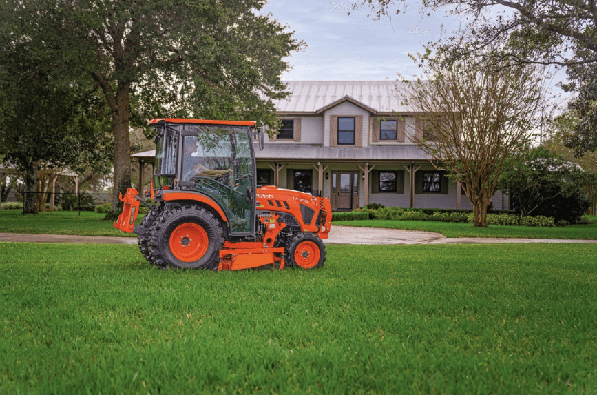 Compact Tractor in front of a house