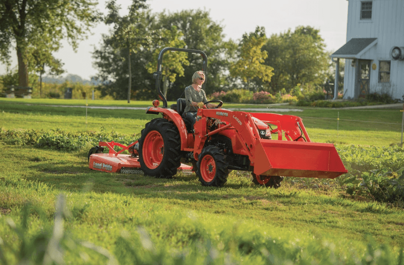 Woman operating tractor