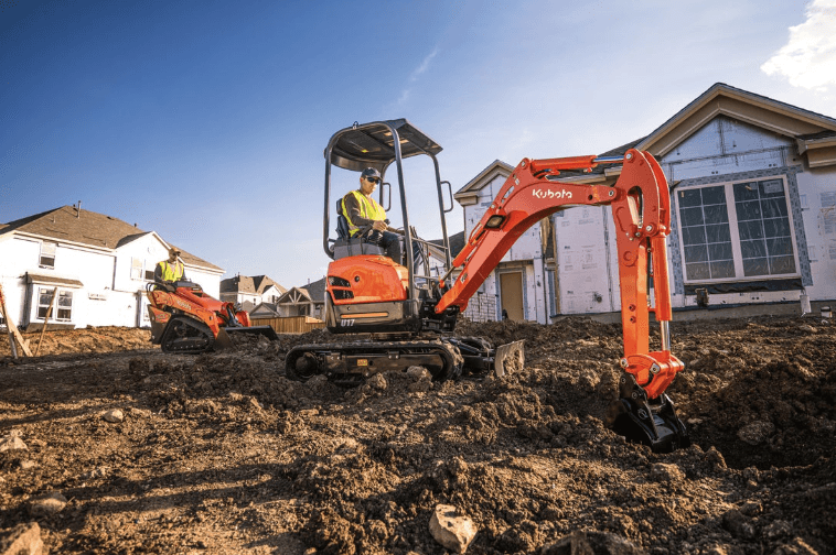 Man using an excavator on site